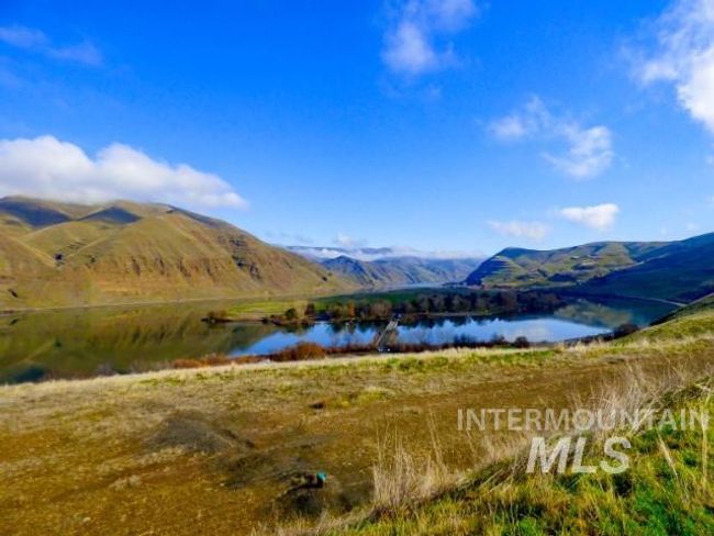 View of mountain background featuring a large body of water | Image 34