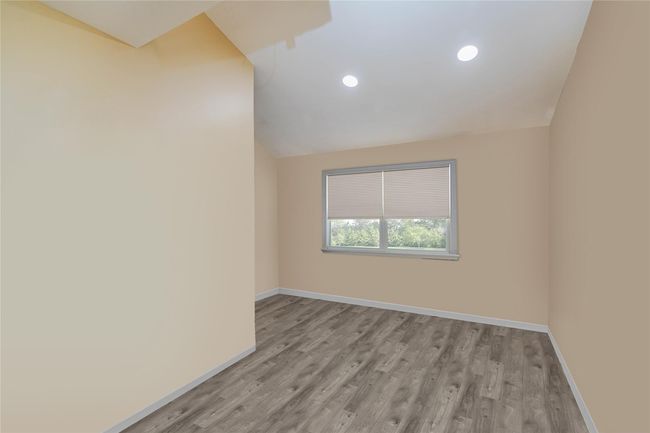 Unfurnished room with recessed lighting, vaulted ceiling, light wood-style flooring, and baseboards | Image 26