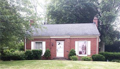 View of front of home featuring a front yard | Image 1