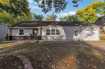 Ranch-style home featuring a garage | Image 3