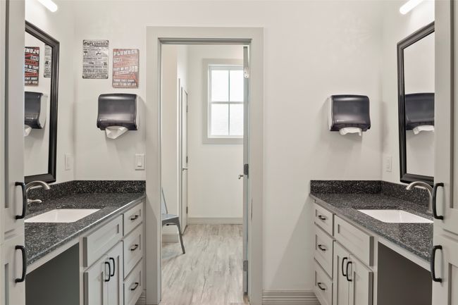 Bathroom with two vanities, a sink, and wood finished floors | Image 22