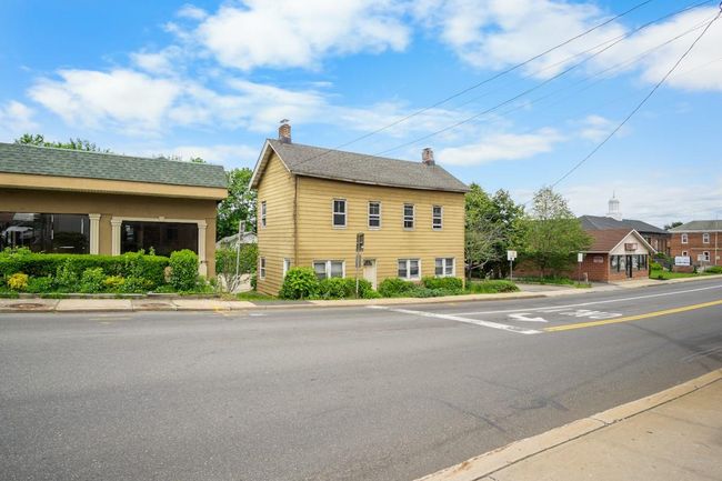 View of home's exterior with a chimney | Image 22