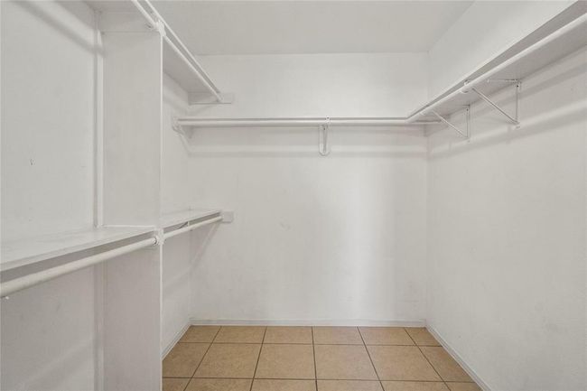 Primary bathroom has a large walk-in closet. | Image 12