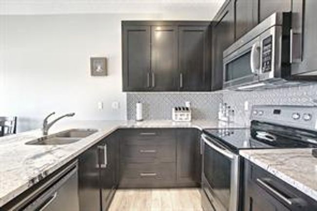 138 - 2802 Kings Heights Gate Se, Home with 3 bedrooms, 2 bathrooms and 2 parking in Airdrie AB | Image 9