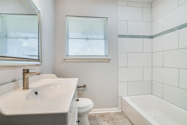 Bathroom with vanity, baseboards, and toilet | Image 21
