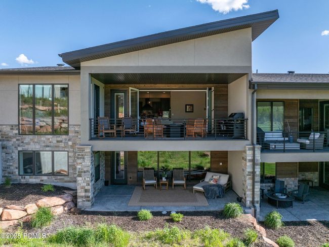 View of back of home with balcony and patio | Image 33