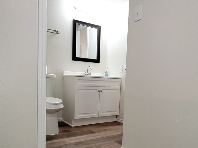 Freshly updated bathroom with in-unit laundry and walk-in closet | Image 12