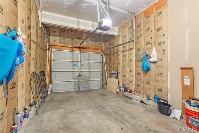 Rear view of property featuring entry steps, a fenced backyard, and a patio area | Image 19