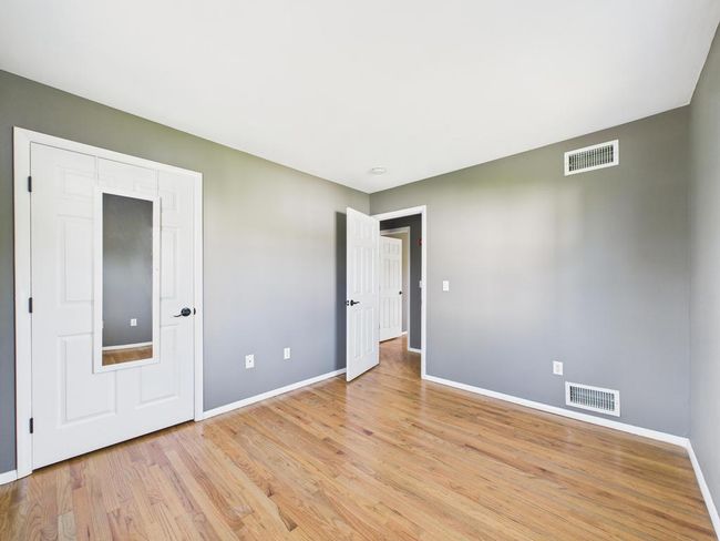Unfurnished bedroom featuring light wood-style floors | Image 26