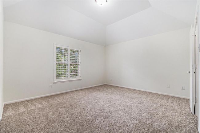 Across the catwalk is the last two of the secondary bedrooms, each very spacious with soft carpet under foot! | Image 35