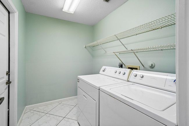 61 W Rubber Tree Dr, House other with 3 bedrooms, 2 bathrooms and null parking in Lake Worth FL | Image 19