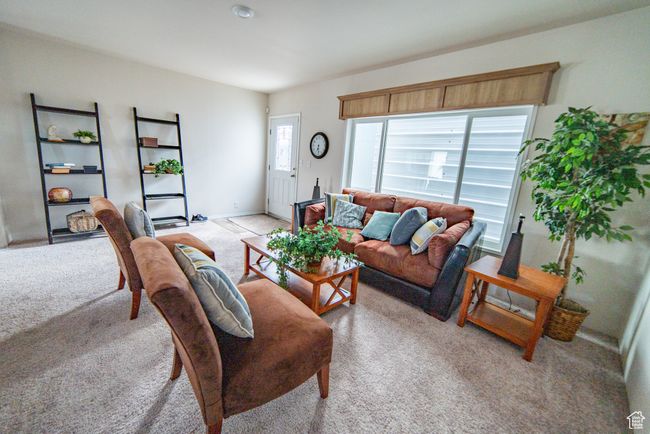 Living room featuring light carpet | Image 43