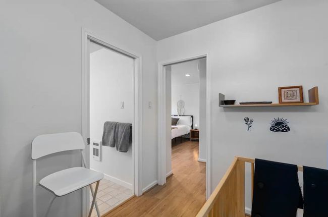 Hall with light wood-style flooring and heating unit | Image 19