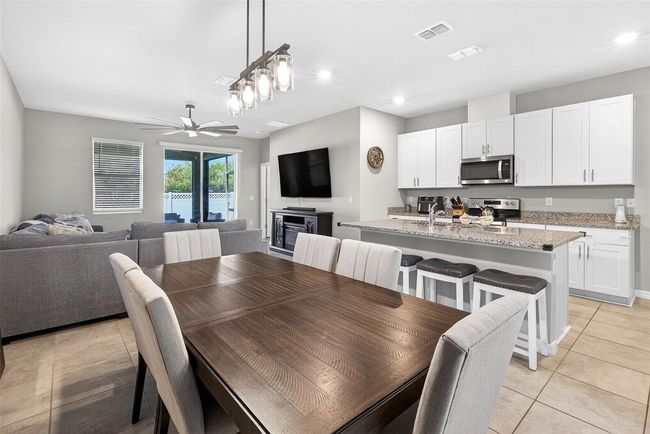 View from the dining area to the living room. | Image 11