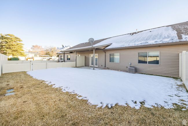 Rear view of house with central AC | Image 14