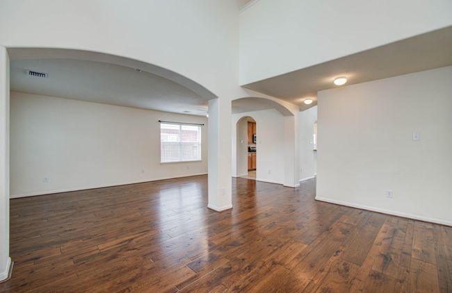 This open floor plan has a formal dining and living area and spacious foyer. | Image 4