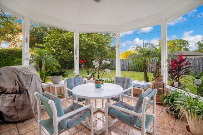 Covered and screened gazebo overlooking large backyard | Image 37