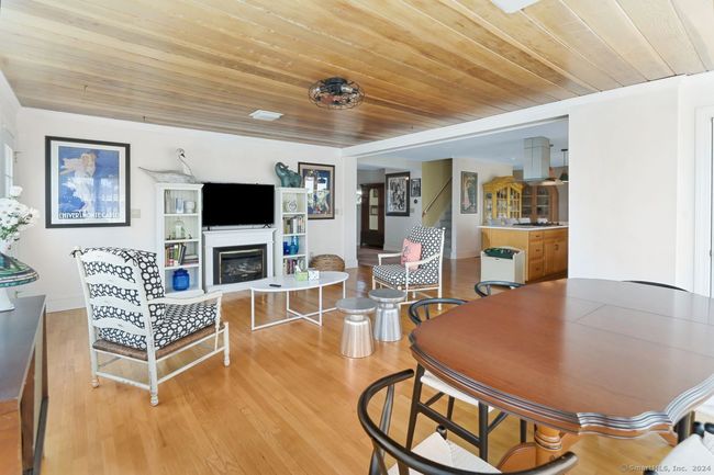 Family room with gas fireplace open to kitchen | Image 13