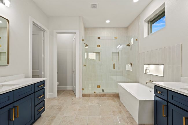 Bathroom with vanity, a shower stall, a freestanding bath, and recessed lighting | Image 15