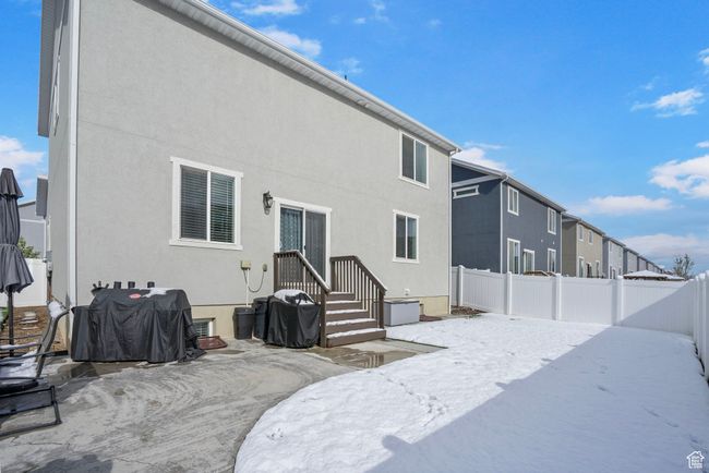 Back of property featuring stucco siding and fence | Image 36