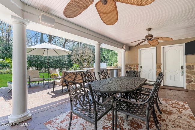 Covered Patio Area with Storage Closet Door and Bathroom Door | Image 94