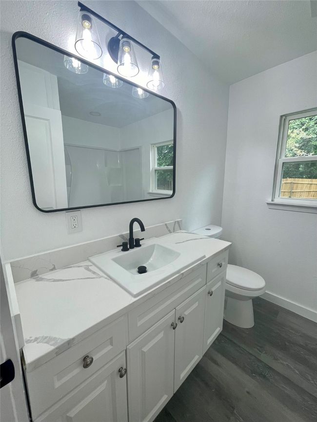 Bathroom featuring wood finished floors and vanity | Image 9