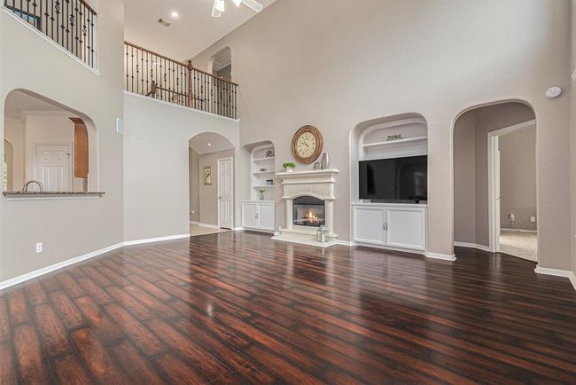 A cast-stone fireplace with hearth and mantel will surely warm the hearts of all that gather here! | Image 9