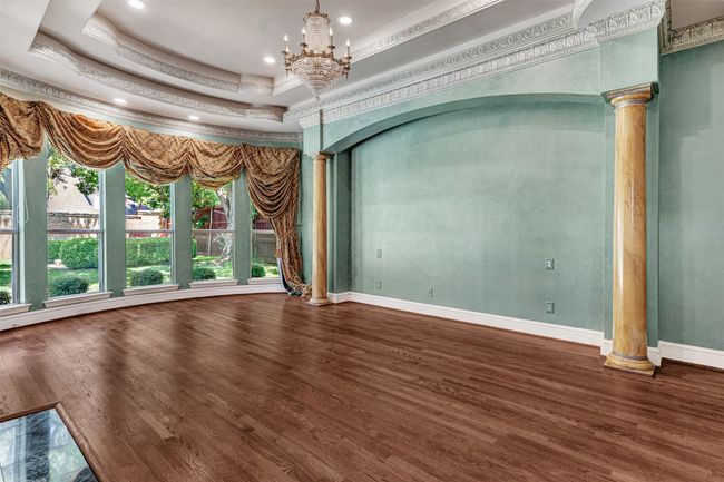 The bay window is a great spot for a peaceful reading nook, a mediation retreat, or even a spot for yoga while contemplating nature just past the window in the extravagant backyard. | Image 21