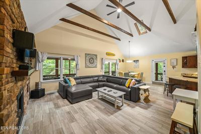 Beamed great room cathedral ceilings with skylights | Image 2