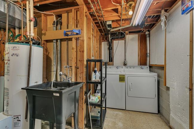 Laundry and Mechanical room with sink. New Furnace installed March 2025! Additional storage room not pictured. | Image 23