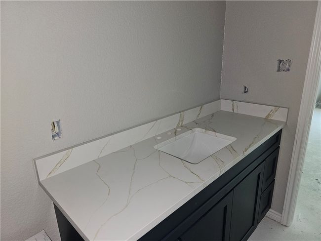 Bathroom featuring vanity | Image 9