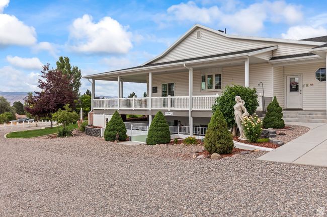 Country-style home featuring covered porch | Image 106
