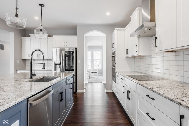 The kitchen continues into a Butler's Pantry and through to the dining room. | Image 17