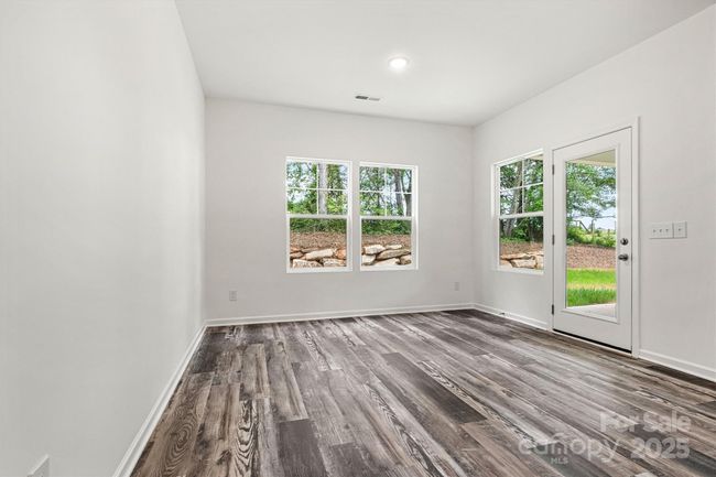 Dining with door to covered patio | Image 26
