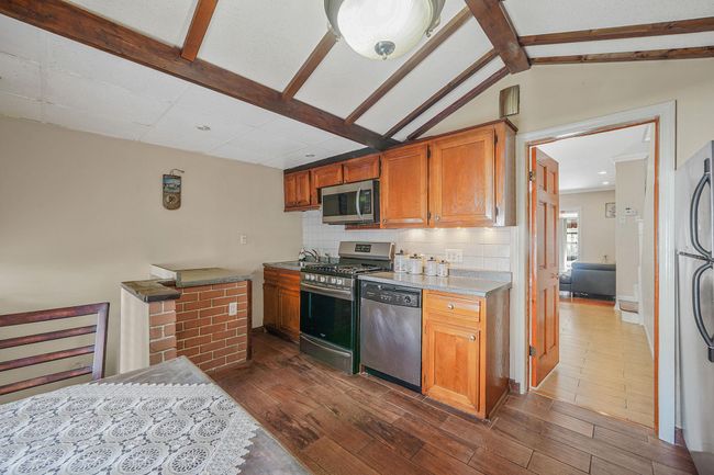 Kitchen featuring appliances with stainless steel finishes | Image 13