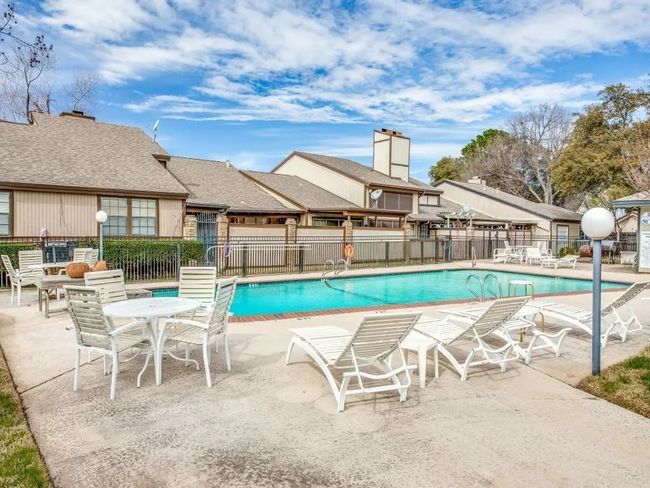 Community pool with a patio area | Image 12