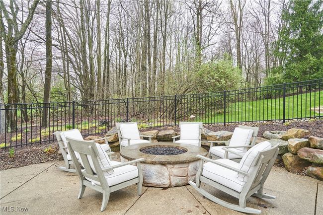View of patio / terrace featuring a fire pit and fence | Image 40