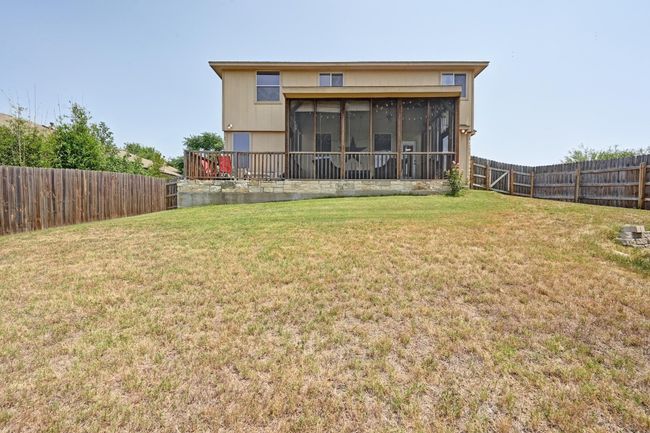 Views of the back exterior and patio spaces. | Image 25
