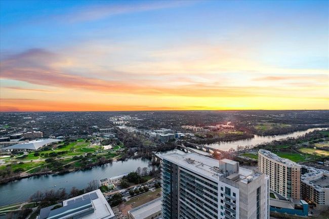 Aerial view at dusk of a water view, a city view | Image 25