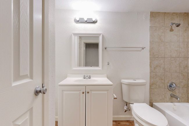 Full bathroom with vanity, tiled shower / bath, and toilet | Image 27
