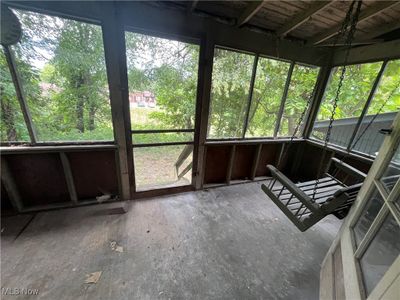 View of unfurnished sunroom | Image 3