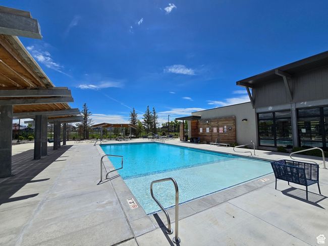 Community pool with a patio area | Image 21