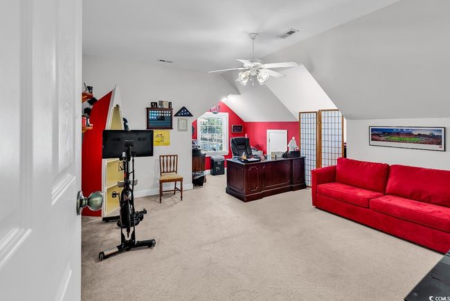 Living room featuring light colored carpet and ceiling fan | Image 32