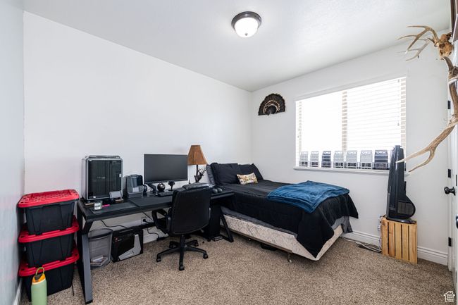 Bedroom with baseboards and carpet floors | Image 20