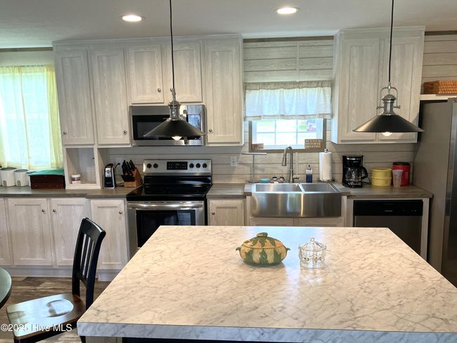 Kitchen features island.. | Image 6