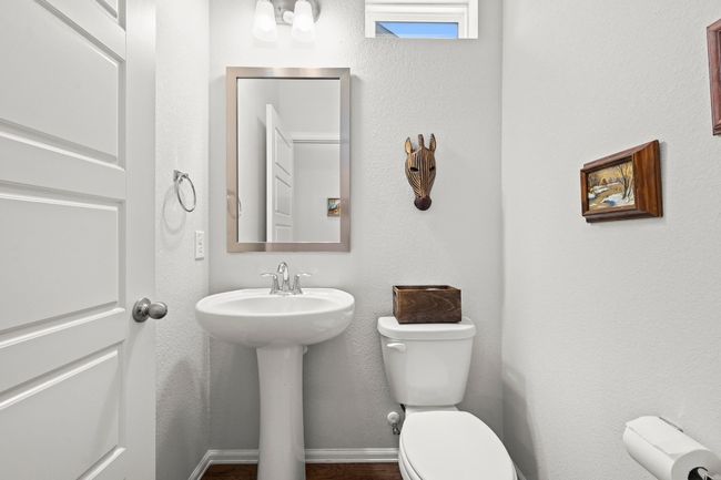 Bathroom with toilet and a sink | Image 15