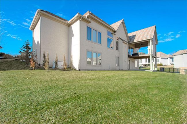 View of exterior entry featuring french doors, stone siding, and stucco siding | Image 4