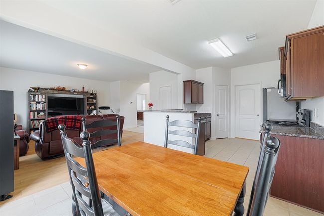 View of family room from the breakfast room. | Image 10