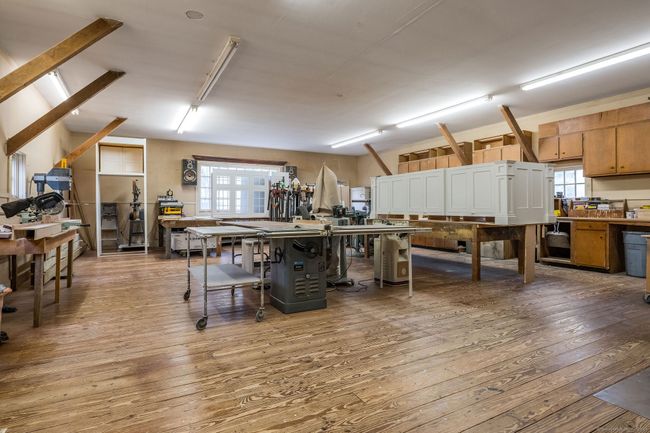 first floor currently used as wood working shop, also included but not pictured: room size spray booth, storage, half bath | Image 34