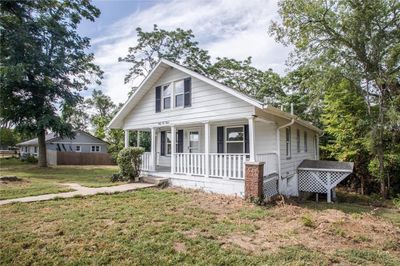 View of front of home with a front yard and a porch | Image 3